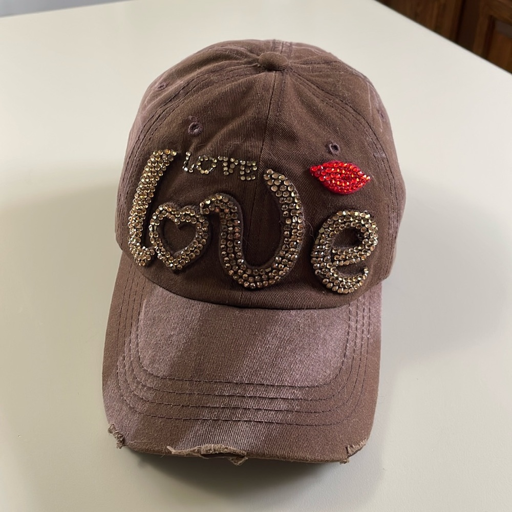Brown and red “love” hat. Gold rhinestones, adjustable strap, cotton